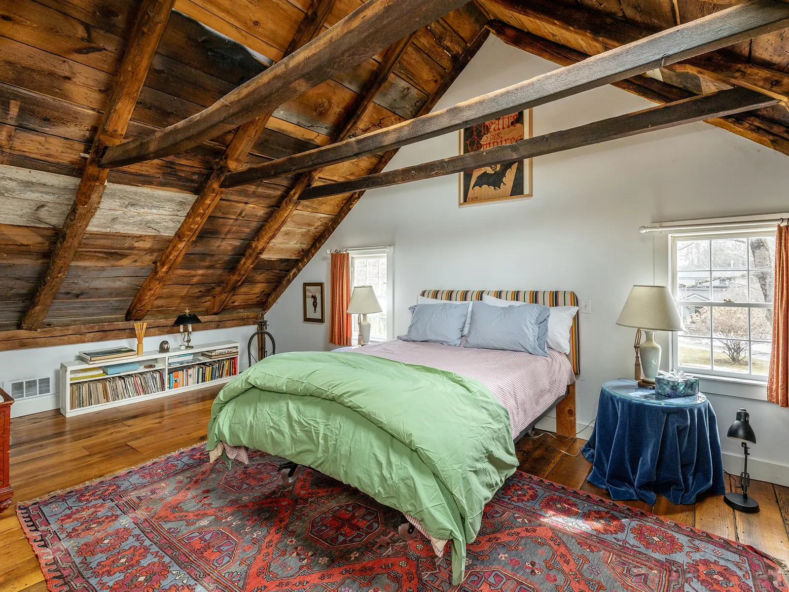 Cottage bedroom under old rafters